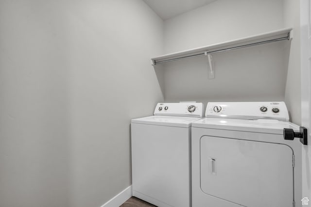 laundry area featuring washer and dryer, laundry area, and baseboards