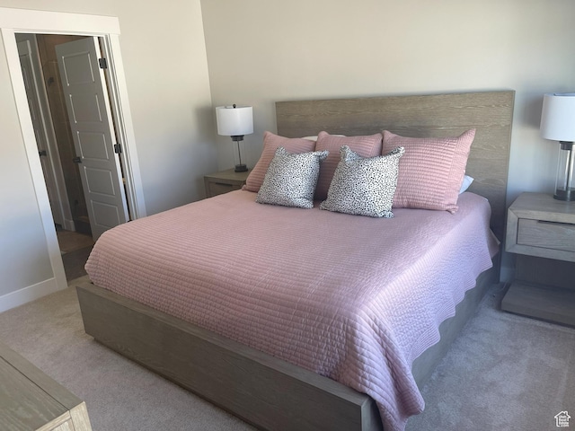 bedroom with carpet floors and baseboards