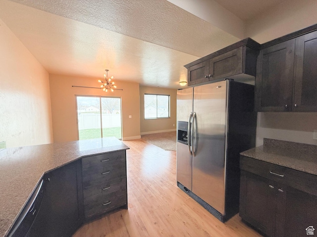 141 E 620 S, Smithfield, UT 84335 - kitchen featuring stainless steel fridge with ice dispenser, light wood-type flooring, a textured ceiling, a chandelier, and baseboards