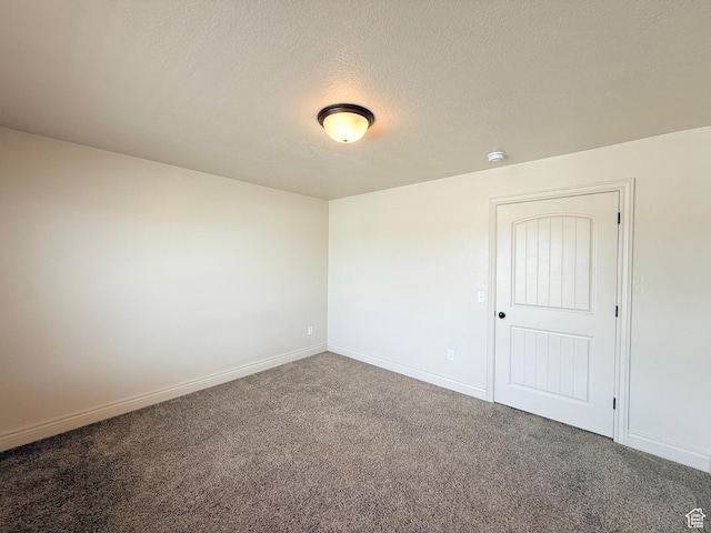 141 E 620 S, Smithfield, UT 84335 - unfurnished room featuring carpet, a textured ceiling, and baseboards