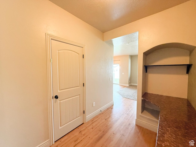 141 E 620 S, Smithfield, UT 84335 - hall with light wood-style flooring, baseboards, and a textured ceiling
