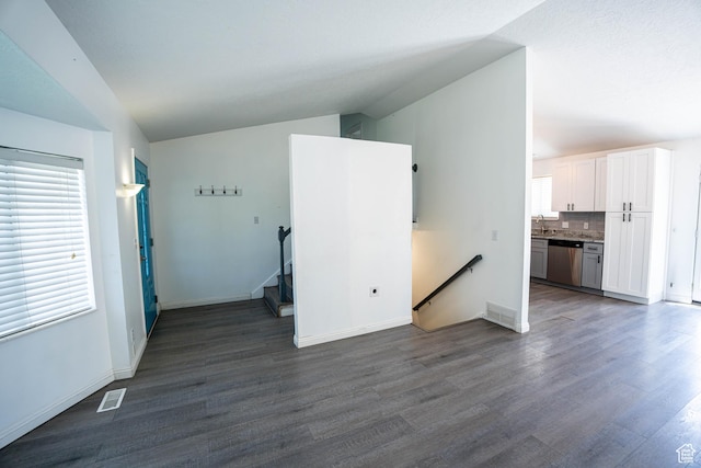 4129 W Misty Dr S, Taylorsville, UT 84129 - unfurnished living room featuring dark wood-style flooring, a sink, and baseboards