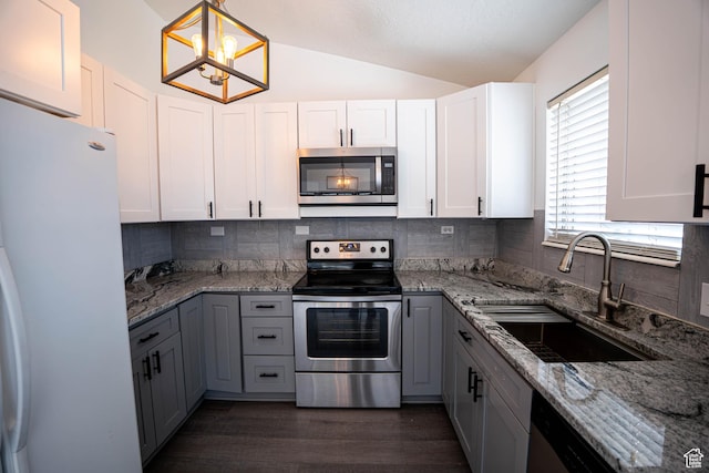 4129 W Misty Dr S, Taylorsville, UT 84129 - kitchen with stainless steel appliances, a sink, lofted ceiling, tasteful backsplash, and light stone counters