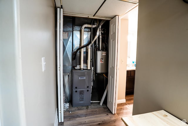 utility room featuring water heater