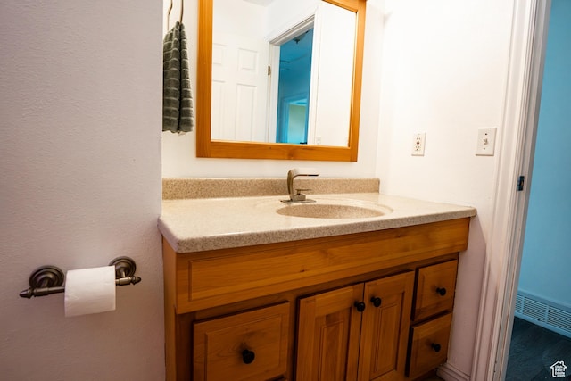 bathroom featuring vanity and visible vents