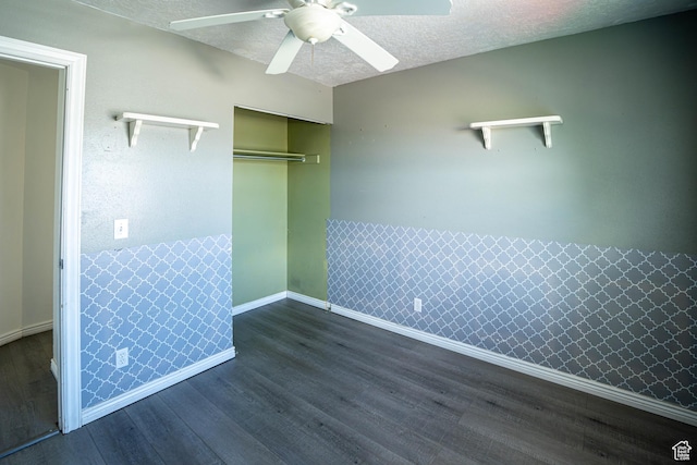 4129 W Misty Dr S, Taylorsville, UT 84129 - unfurnished bedroom with dark wood-type flooring, a closet, a textured ceiling, baseboards, and a ceiling fan