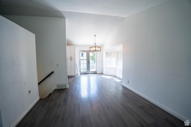 4129 W Misty Dr S, Taylorsville, UT 84129 - unfurnished living room with dark wood-style flooring, baseboards, lofted ceiling, a chandelier, and a textured ceiling
