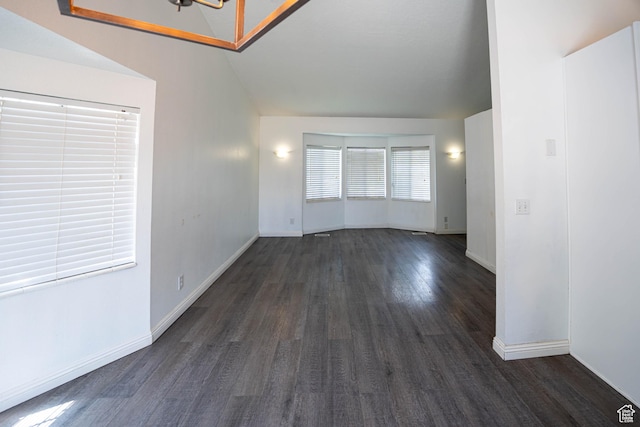 4129 W Misty Dr S, Taylorsville, UT 84129 - spare room with dark wood-style floors, baseboards, and lofted ceiling