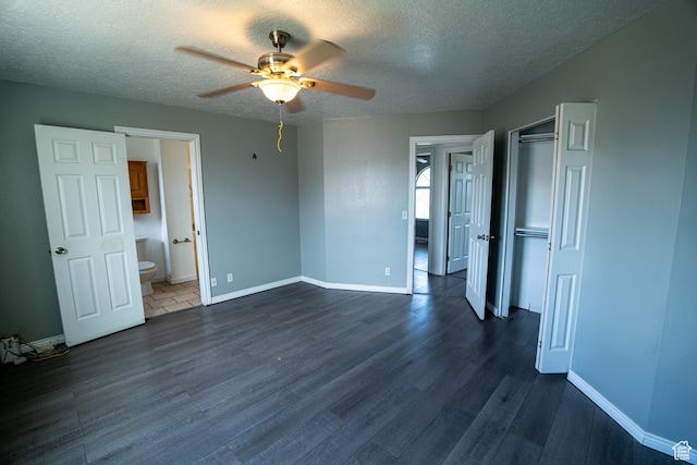 4129 W Misty Dr S, Taylorsville, UT 84129 - unfurnished bedroom featuring dark wood-style flooring, a textured ceiling, baseboards, a closet, and ceiling fan