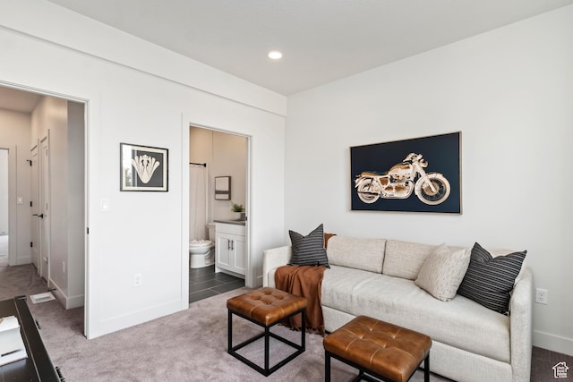 carpeted living room featuring recessed lighting and baseboards
