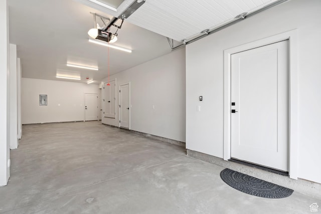 garage featuring a garage door opener and electric panel