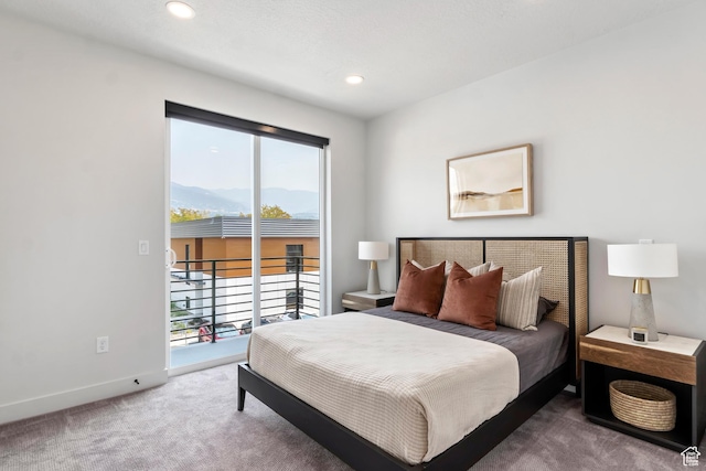 carpeted bedroom featuring a mountain view, access to exterior, recessed lighting, and baseboards