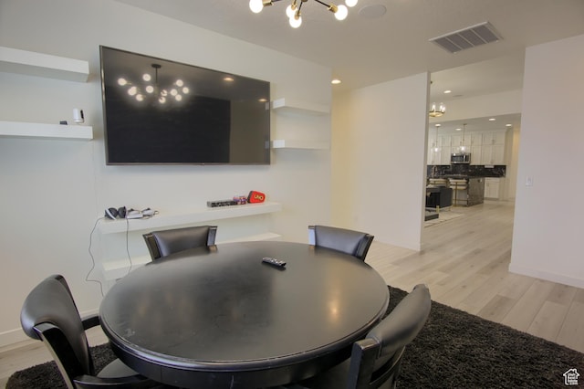 2543 W 3350 S Unit 210, Syracuse, UT 84075 - dining area featuring a chandelier, light wood-style floors, baseboards, visible vents, and recessed lighting