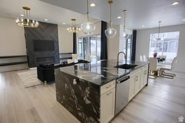2543 W 3350 S Unit 210, Syracuse, UT 84075 - kitchen featuring a chandelier, a wealth of natural light, stainless steel dishwasher, and a sink