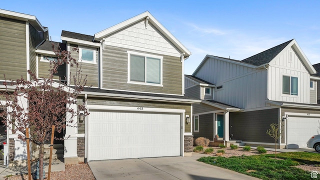 448 S Pegasus Way, Saratoga Springs, UT 84045 - view of front of property featuring concrete driveway, board and batten siding, a garage, and stone siding