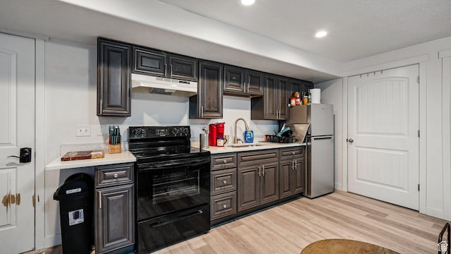 448 S Pegasus Way, Saratoga Springs, UT 84045 - kitchen featuring light countertops, freestanding refrigerator, electric range, under cabinet range hood, and a sink