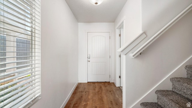 448 S Pegasus Way, Saratoga Springs, UT 84045 - interior space featuring baseboards, light wood finished floors, stairway, and a textured ceiling