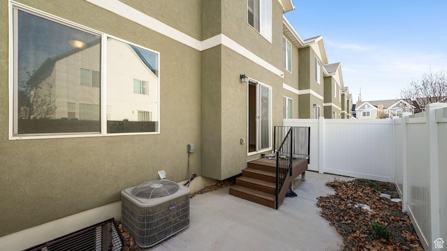 448 S Pegasus Way, Saratoga Springs, UT 84045 - view of side of property featuring central air condition unit, a residential view, stucco siding, and fence