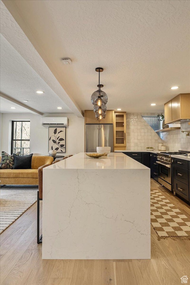 5290 E Emigration Canyon Rd, Salt Lake City, UT 84108 - kitchen with tasteful backsplash, premium appliances, dark cabinetry, and light wood-style floors
