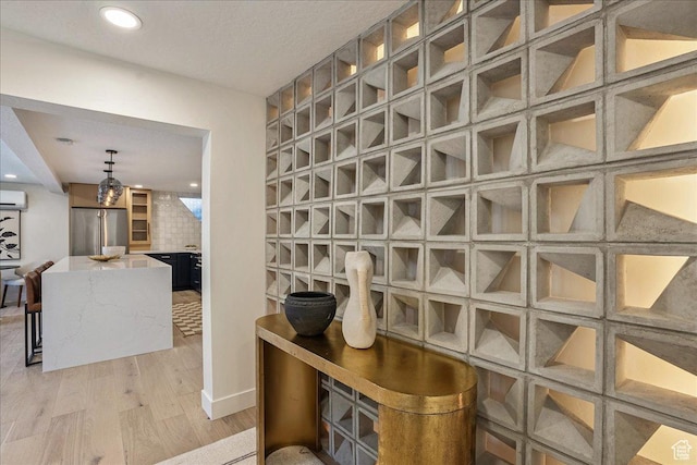 5290 E Emigration Canyon Rd, Salt Lake City, UT 84108 - interior space with light wood-style flooring, a wall mounted AC, a fireplace, and recessed lighting