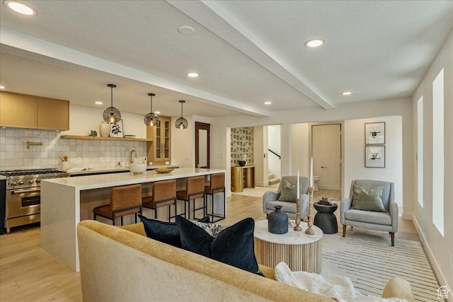 5290 E Emigration Canyon Rd, Salt Lake City, UT 84108 - living room featuring light wood-style floors, beamed ceiling, recessed lighting, stairway, and baseboards