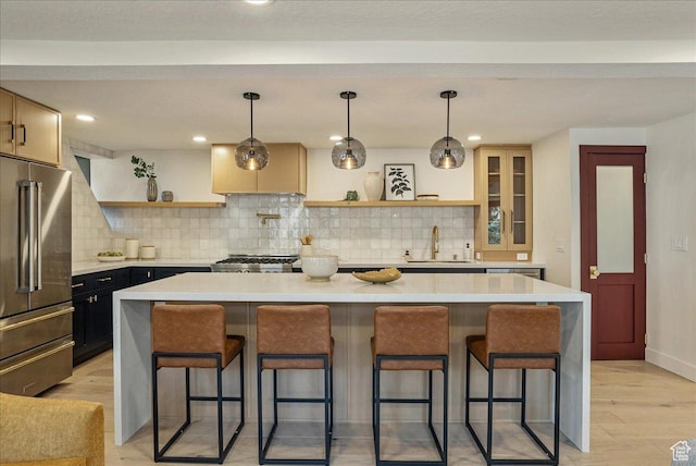 5290 E Emigration Canyon Rd, Salt Lake City, UT 84108 - kitchen with open shelves, light countertops, a sink, a breakfast bar area, and high end fridge