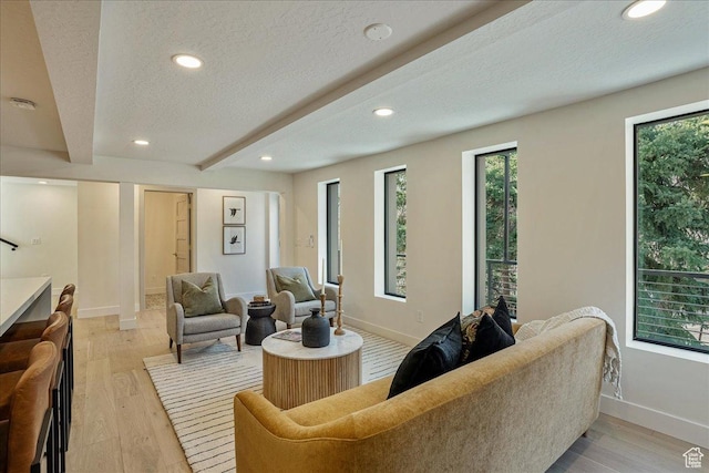 5290 E Emigration Canyon Rd, Salt Lake City, UT 84108 - living area with baseboards, light wood-type flooring, recessed lighting, a textured ceiling, and beamed ceiling