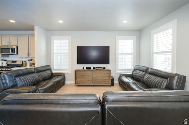 11531 S Bingham Rim Rd, South Jordan, UT 84009 - living room featuring baseboards, light wood finished floors, and recessed lighting