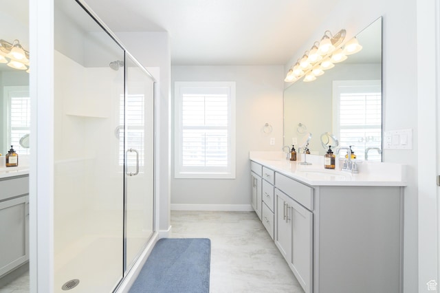 11531 S Bingham Rim Rd, South Jordan, UT 84009 - bathroom featuring double vanity, baseboards, a sink, and a stall shower