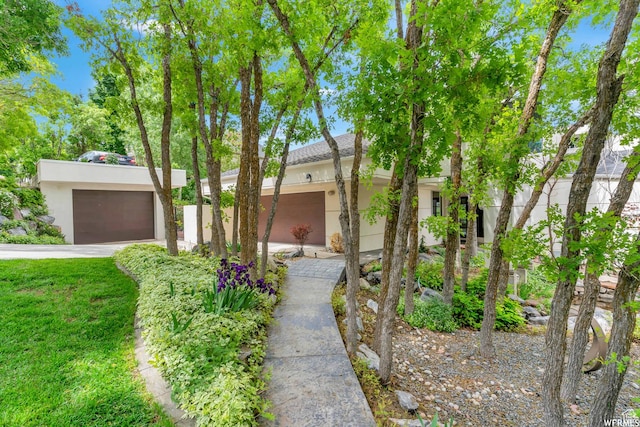 276 S 600 E, Alpine, UT 84004 - view of front of home with stucco siding, an attached garage, and a front lawn