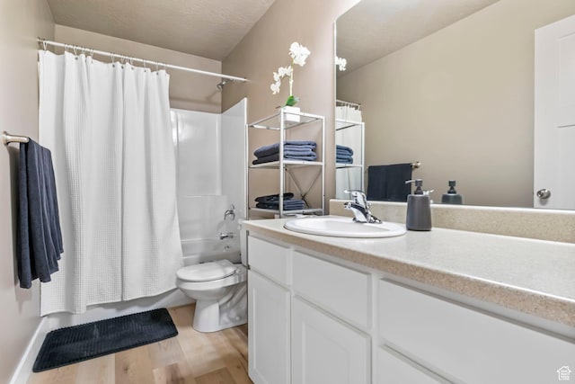 473 S 2400 W Unit 3, Springville, UT 84663 - bathroom with shower / tub combo, toilet, a textured ceiling, vanity, and wood finished floors