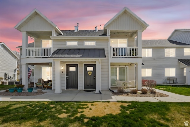 473 S 2400 W Unit 3, Springville, UT 84663 - back of house at dusk featuring board and batten siding, metal roof, a standing seam roof, and a balcony