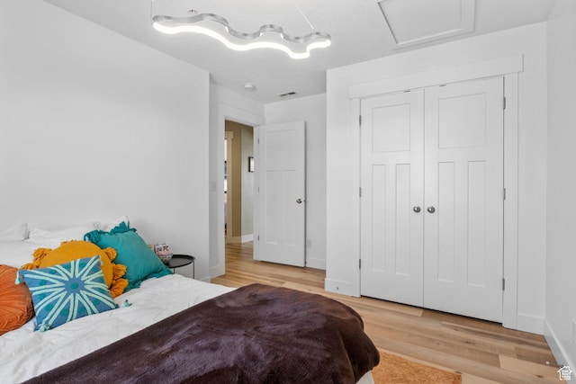 473 S 2400 W Unit 3, Springville, UT 84663 - bedroom featuring light wood finished floors, baseboards, and attic access