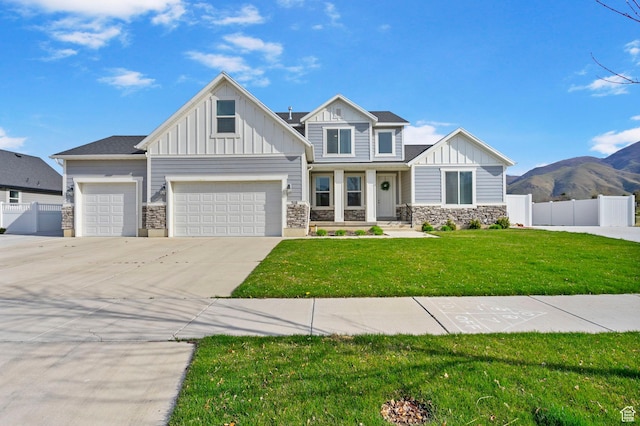 516 W 1000 N, Mapleton, UT 84664 - craftsman inspired home with a front yard, stone siding, board and batten siding, fence, and driveway