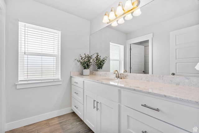 516 W 1000 N, Mapleton, UT 84664 - bathroom featuring vanity, baseboards, and wood finished floors
