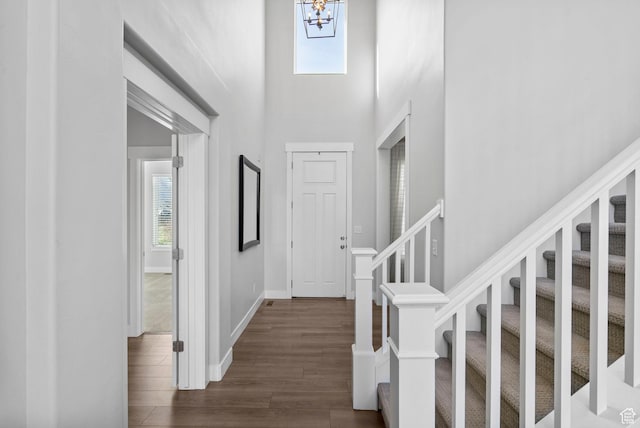 516 W 1000 N, Mapleton, UT 84664 - entryway featuring an inviting chandelier, a towering ceiling, dark wood-style flooring, stairs, and baseboards