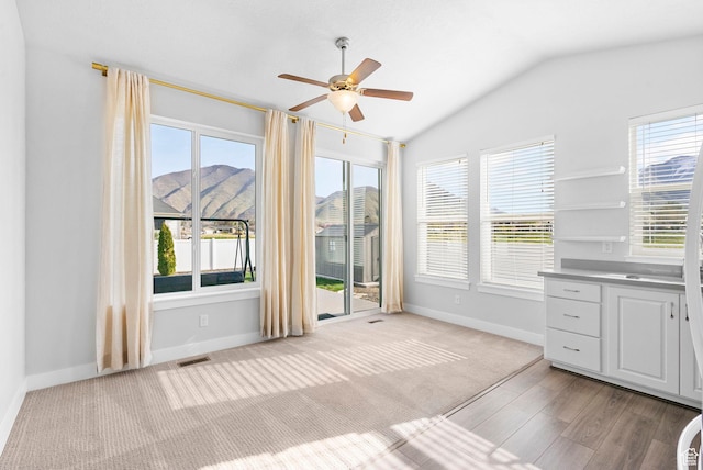 516 W 1000 N, Mapleton, UT 84664 - interior space with lofted ceiling, baseboards, light carpet, visible vents, and ceiling fan