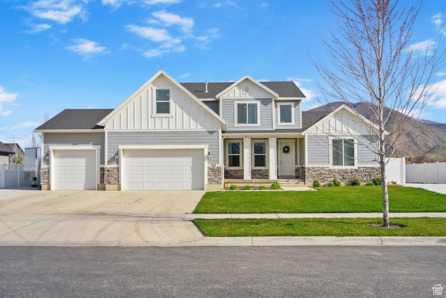 516 W 1000 N, Mapleton, UT 84664 - craftsman-style home with driveway, board and batten siding, stone siding, a front lawn, and fence