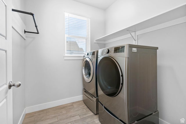 516 W 1000 N, Mapleton, UT 84664 - clothes washing area with independent washer and dryer, light wood finished floors, laundry area, and baseboards