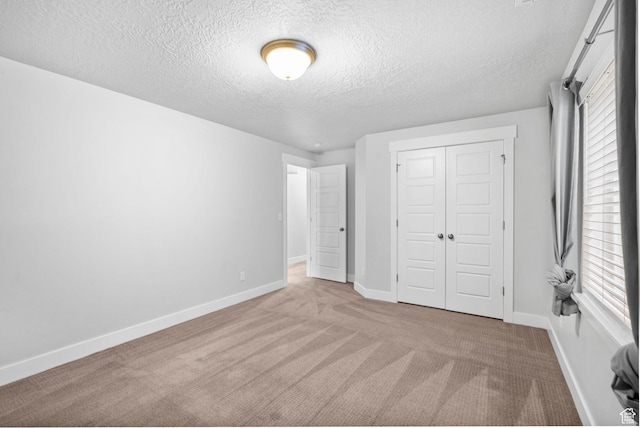 516 W 1000 N, Mapleton, UT 84664 - unfurnished bedroom featuring carpet floors, baseboards, a closet, and a textured ceiling