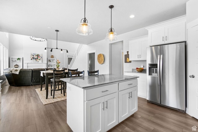 516 W 1000 N, Mapleton, UT 84664 - kitchen featuring stainless steel fridge with ice dispenser, open floor plan, a kitchen island, dark wood-type flooring, and hanging light fixtures