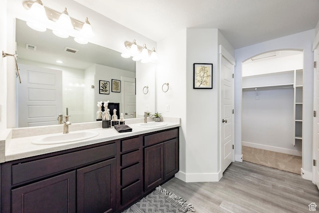 1629 N 3860 W, Lehi, UT 84043 - bathroom with baseboards, double vanity, a sink, and visible vents