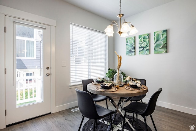 1629 N 3860 W, Lehi, UT 84043 - dining area with a wealth of natural light, an inviting chandelier, and wood finished floors