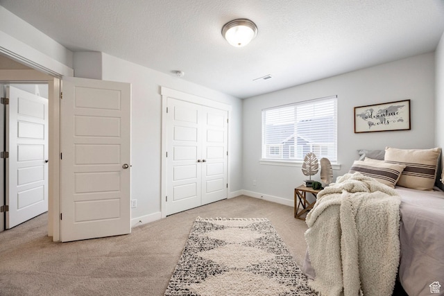 1629 N 3860 W, Lehi, UT 84043 - bedroom featuring a textured ceiling, a closet, light colored carpet, and baseboards