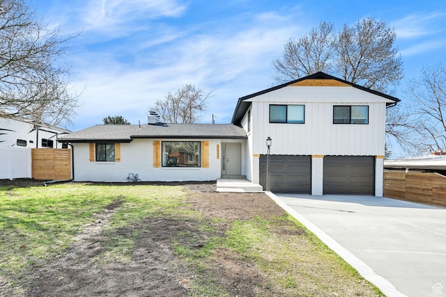 1289 E 31st St S, Ogden, UT 84403 - view of front of house featuring a front yard, a garage, fence, concrete driveway, and brick siding