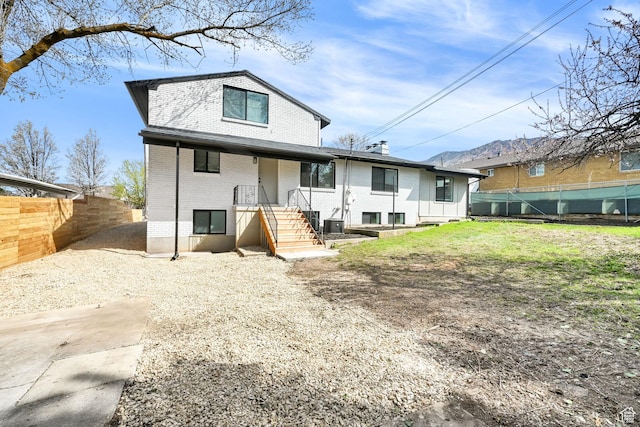1289 E 31st St S, Ogden, UT 84403 - rear view of house with brick siding and fence