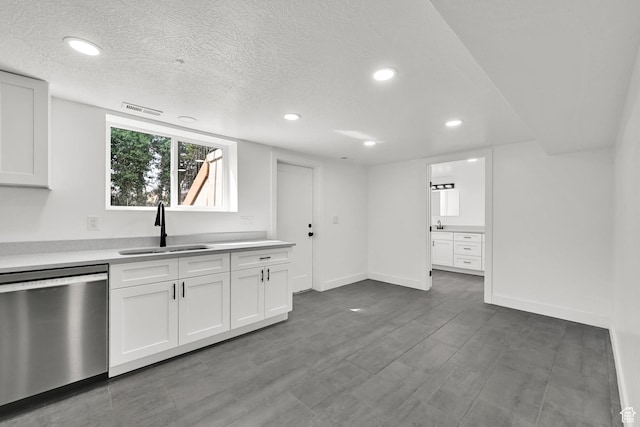 1289 E 31st St S, Ogden, UT 84403 - kitchen featuring visible vents, white cabinets, a sink, light countertops, and stainless steel dishwasher