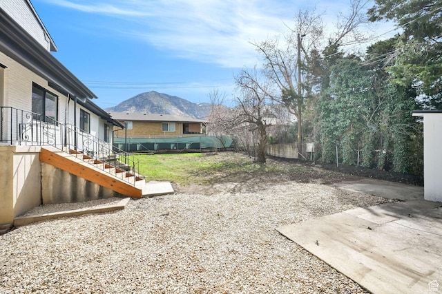 1289 E 31st St S, Ogden, UT 84403 - view of yard featuring a mountain view, a patio area, and stairs