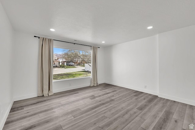 1289 E 31st St S, Ogden, UT 84403 - unfurnished room with light wood-style flooring, baseboards, and recessed lighting