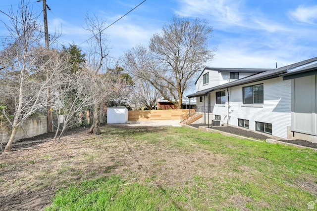 1289 E 31st St S, Ogden, UT 84403 - view of yard featuring a fenced backyard, an outdoor structure, and a shed